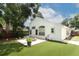 Backyard view showcasing landscaping, hardscape and synthetic lawn at 5165 Mystic Point Ct, Orlando, FL 32812
