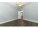 Neutral bedroom offering wood-look flooring and a ceiling fan at 5165 Mystic Point Ct, Orlando, FL 32812