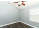 Compact bedroom shows new floors, overhead light, and a window for natural light at 5165 Mystic Point Ct, Orlando, FL 32812