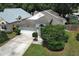 Attractive single Gathering home featuring an attached two car garage and mature landscaping at 5165 Mystic Point Ct, Orlando, FL 32812