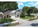 Charming single Gathering home featuring a well manicured lawn and attached garage at 5165 Mystic Point Ct, Orlando, FL 32812