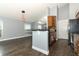 Bright kitchen with breakfast bar, stainless steel appliances and hardwood floors at 5165 Mystic Point Ct, Orlando, FL 32812