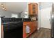Updated kitchen boasts granite counters, wood cabinets, and stainless steel appliances at 5165 Mystic Point Ct, Orlando, FL 32812