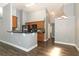 Modern kitchen with granite counters, wood cabinets, breakfast bar, and stainless appliances at 5165 Mystic Point Ct, Orlando, FL 32812