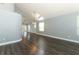 An expansive living area with new floors, neutral paint, views of the patio through the glass doors, and modern lighting at 5165 Mystic Point Ct, Orlando, FL 32812