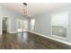 Comfortable living room features hardwood floors, neutral paint and bright natural light at 5165 Mystic Point Ct, Orlando, FL 32812