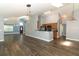 Large living room opens to the kitchen with hardwood floors and lots of natural light at 5165 Mystic Point Ct, Orlando, FL 32812