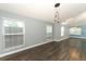 Spacious living room features hardwood floors, high ceilings, and lots of natural light at 5165 Mystic Point Ct, Orlando, FL 32812