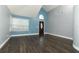 Open living space featuring new floors, fresh paint, tall ceilings, and ample natural light from the large window at 5165 Mystic Point Ct, Orlando, FL 32812