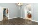 The main bedroom includes wood-look flooring and ensuite bathroom at 5165 Mystic Point Ct, Orlando, FL 32812