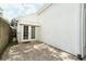 Enclosed patio area with brick pavers and double doors to the home's interior at 5165 Mystic Point Ct, Orlando, FL 32812