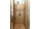 Detailed shot of a newly tiled shower with modern fixtures and a built-in niche at 5165 Mystic Point Ct, Orlando, FL 32812