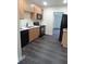 Modern kitchen featuring stainless steel appliances, ample cabinet space, and sleek countertops at 5416 Vance Ave, Orlando, FL 32810