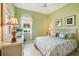 Charming bedroom with a window view, cozy furniture, and decorative accents creating a relaxing space at 5453 Grove Mnr, Lady Lake, FL 32159