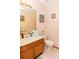 Cozy bathroom featuring a vanity with a sink, a mirror, and a toilet at 596 Starstone Dr, Lake Mary, FL 32746