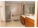 The primary bathroom boasts a walk-in shower, soaking tub, and a double sink vanity at 596 Starstone Dr, Lake Mary, FL 32746