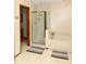 Bathroom featuring a glass enclosed shower, tub, and tiled floor at 596 Starstone Dr, Lake Mary, FL 32746