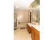 Bright bathroom featuring a double sink vanity, large mirror, and a separate shower and tub at 596 Starstone Dr, Lake Mary, FL 32746