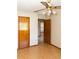 Cozy bedroom with hardwood floors, a ceiling fan, and neutral walls, creating a serene and inviting atmosphere at 596 Starstone Dr, Lake Mary, FL 32746