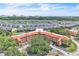 Stunning aerial view of condo complex with landscaping, parking and nearby community at 6337 Parc Corniche Dr # 2312, Orlando, FL 32821