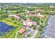Aerial view of resort-style community with multiple pools, lakes, lush landscaping and condominium buildings at 6337 Parc Corniche Dr # 2312, Orlando, FL 32821