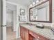Bathroom featuring granite counters and ample space, combining functionality with a touch of elegance at 6337 Parc Corniche Dr # 2312, Orlando, FL 32821
