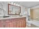 Well-lit bathroom featuring a spacious vanity with granite countertops and a shower-tub combination at 6337 Parc Corniche Dr # 2312, Orlando, FL 32821