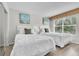 Charming bedroom featuring two twin beds, natural light, and closet for comfortable living at 6337 Parc Corniche Dr # 2312, Orlando, FL 32821