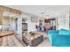 Bright living room with stylish furniture, adjacent dining area and balcony access, perfect for entertaining guests at 6337 Parc Corniche Dr # 2312, Orlando, FL 32821