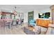 Inviting view of living, kitchen, and dining spaces with modern furnishings and decor at 6337 Parc Corniche Dr # 2312, Orlando, FL 32821