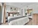 Comfortable main bedroom featuring a king bed, modern decor, and closet space for optimal convenience at 6337 Parc Corniche Dr # 2312, Orlando, FL 32821