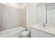 Bright bathroom featuring a shower over the tub and a vanity with a quartz countertop at 6723 Sherpa Trl, St Cloud, FL 34771