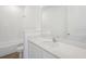 Bathroom featuring a white sink, large mirror, tiled wall, and tiled floors at 6723 Sherpa Trl, St Cloud, FL 34771