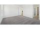Spacious bedroom with neutral carpeting, white walls, and an ensuite bathroom at 6723 Sherpa Trl, St Cloud, FL 34771