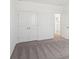Spacious bedroom featuring neutral carpets, double closets, and access to the ensuite bathroom at 6723 Sherpa Trl, St Cloud, FL 34771