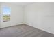 Carpeted bedroom featuring bright windows and neutral-colored walls at 6723 Sherpa Trl, St Cloud, FL 34771
