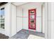 Inviting front entry with a red door featuring decorative glass panels and gray paver stones at 6723 Sherpa Trl, St Cloud, FL 34771