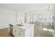 Open kitchen featuring a sleek island, stainless steel appliances, and a seamless flow to the living space at 6723 Sherpa Trl, St Cloud, FL 34771