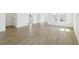 Spacious open-concept layout with wood-look flooring and ample natural light at 6723 Sherpa Trl, St Cloud, FL 34771
