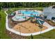 Aerial view of the community playground, splash pad, and pool at 7053 Painted Bunting Way, St Cloud, FL 34773