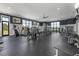 Gym boasts modern exercise equipment, ample space, and natural light from large windows at 7053 Painted Bunting Way, St Cloud, FL 34773