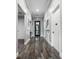 Hallway features lovely gray walls with white trim and wood style floors at 7053 Painted Bunting Way, St Cloud, FL 34773