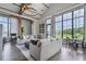 Open-concept community center lounge with vaulted ceilings and large picture windows at 7053 Painted Bunting Way, St Cloud, FL 34773
