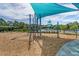 The playground features rope-climbing structures, and a sunshade for safe, comfortable outdoor play at 7053 Painted Bunting Way, St Cloud, FL 34773