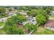 A well-landscaped house equipped with solar panels, featuring a relaxing swimming pool in a lush setting at 7124 Turquoise Ln, Orlando, FL 32807