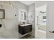 Modern bathroom featuring a frameless glass shower, black fixtures and updated vanity at 7124 Turquoise Ln, Orlando, FL 32807