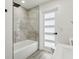 Bathroom featuring modern tiling in the shower area and a stylish frosted glass door at 7124 Turquoise Ln, Orlando, FL 32807