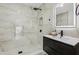 Modern bathroom featuring a frameless glass shower, black fixtures and updated vanity at 7124 Turquoise Ln, Orlando, FL 32807