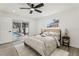 This bedroom features a sliding glass door leading to the beautiful outdoor pool area at 7124 Turquoise Ln, Orlando, FL 32807