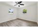 This bedroom features plenty of natural light with two windows overlooking the yard at 7124 Turquoise Ln, Orlando, FL 32807